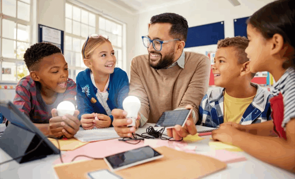 Teacher surrounded by students in classroom.